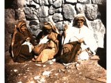 Women making `fine linen` and silk clothing. The crescent of coins set edgewise on the head holds in position the veil.